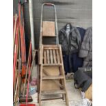 A VINTAGE WOODEN TWO RUNG STEP LADDER AND TWO FURTHER STEP LADDERS