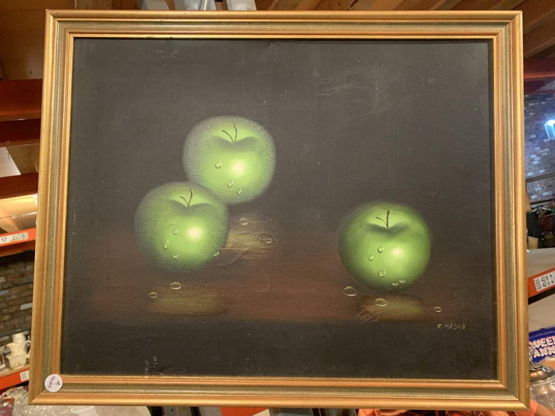 A FRAMED STILL LIFE PAINTING ON CANVAS OF APPLES AGAINST A BLACK BACKGROUND