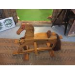 A WOODEN ROCKING HORSE