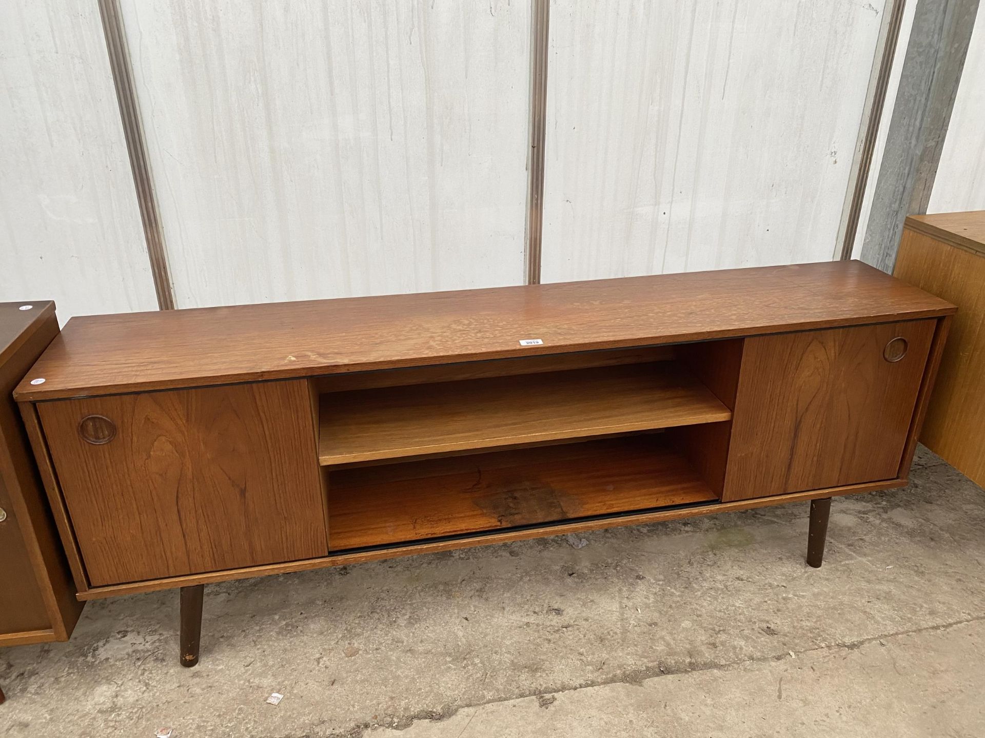 A RETRO TEAK AVALON SIDE CABINET WITH TWO SLIDING DOORS, 64" WIDE