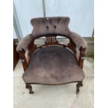 A VICTORIAN UPHOLSTERED TUB CHAIR WITH BUTTONED TOP RAIL