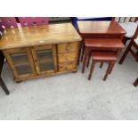 A MODERN PINE LOW GLAZED CABINET BY CORNDELL FURNITURE CO (WHITNEY), AND A NEST OF THREE TABLES