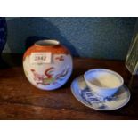 A NANKING CARGO BLUE AND WHITE TEA BOWL AND SAUCER WITH CHRISTIES LABEL, LOT 5061 A/F AND A GINGER