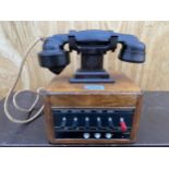 A VINTAGE BAKELITE DICTOGRAPH TELEPHONE SYSTEM WITH AN OAK CASED BOTTOM BELIEVED TO BE A BANK SWITCH