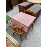 A FORMICA TOP DROP-LEAF KITCHEN TABLE AND TWO PINE CHAIRS