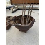 A VINTAGE CAST IRON HANGING COOKING POT AND TWO SETS OF VINTAGE PLIERS