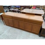 A RETRO TEAK MCINTOSH SIDEBOARD ENCLOSING THREE CUPBOARDS AND THREE DRAWERS 71" WIDE