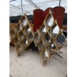 A PAIR OF MIRRORED PIERCED GOLD COLOURED METALWARE WALL MOUNTED CANDLE STANDS