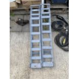 A PAIR OF METAL CAR RAMPS