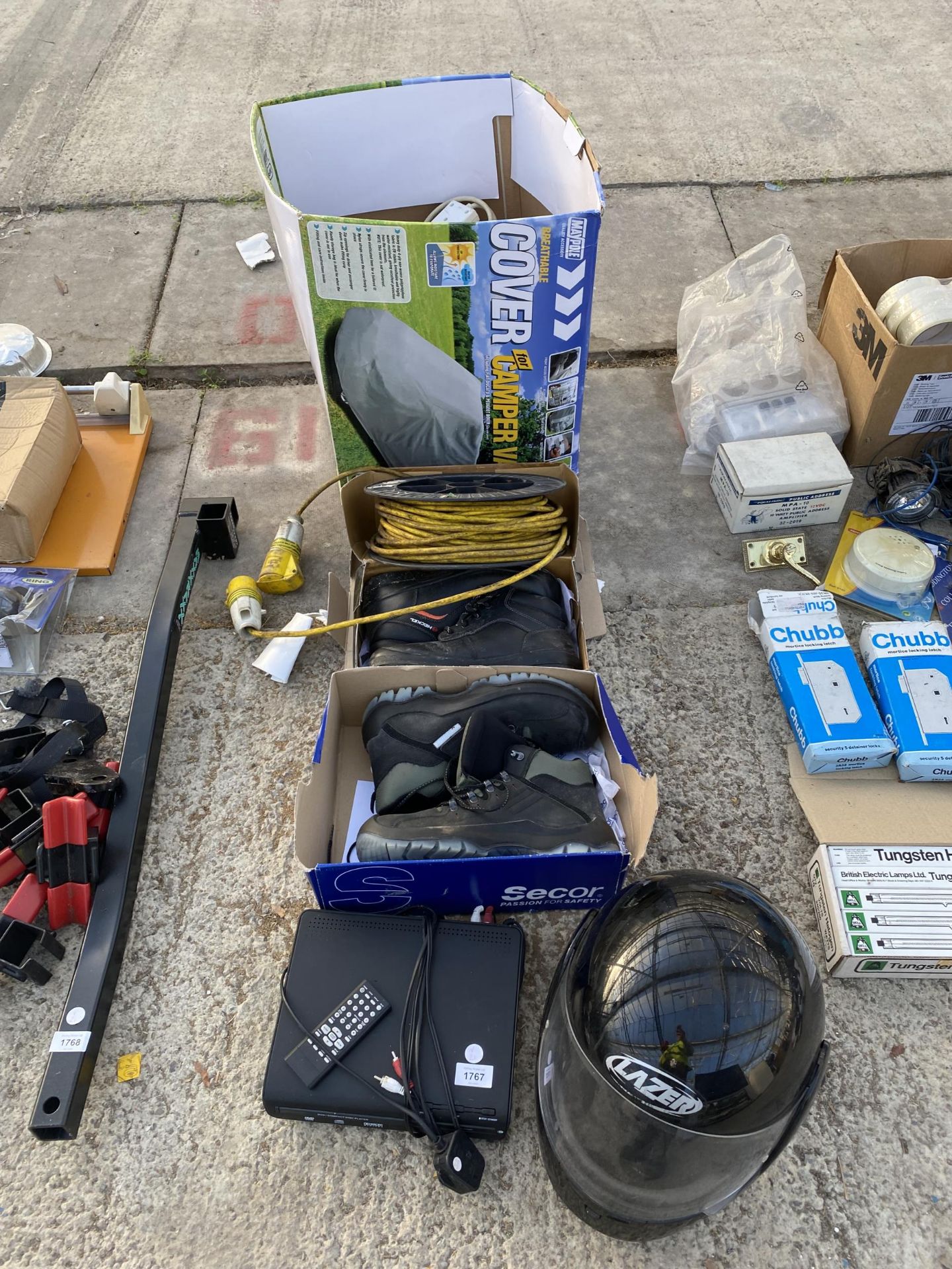 AN ASSORTMENT OF ITEMS TO INCLUDE WORK BOOTS, EXTENSION LEADS AND A HELMET ETC