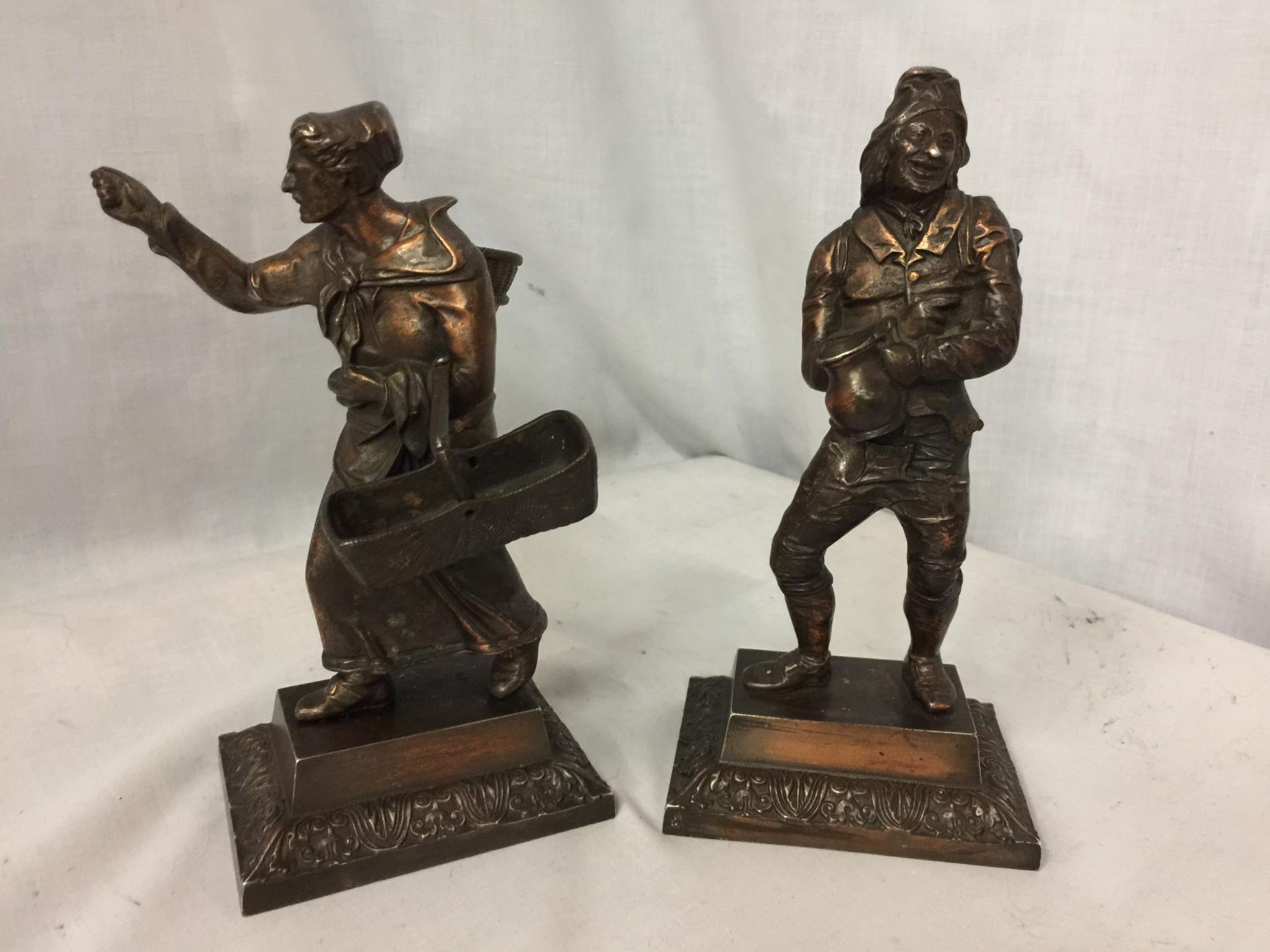 A PAIR OF BRONZE DIPPED METAL FIGURINES