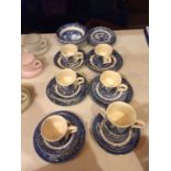 A NUMBER OF WILLOW WARE CUPS AND SAUCERS AND BOWLS