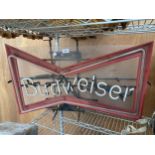 A NEON 'BUDWISER' ADVERTISING LIGHT