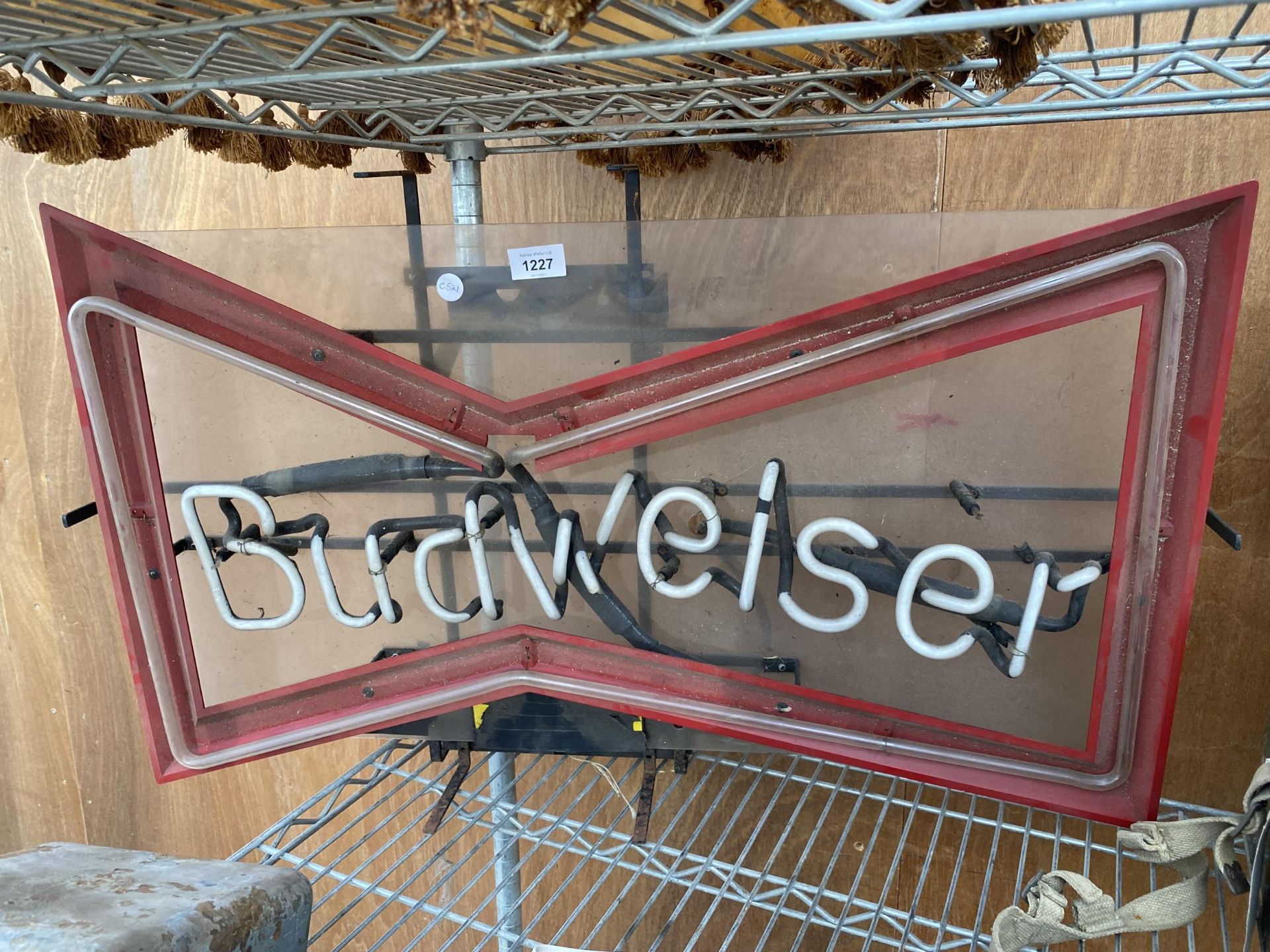 A NEON 'BUDWISER' ADVERTISING LIGHT