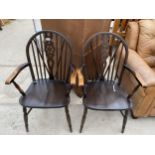 A PAIR OF WHEELBACK ELBOW CHAIRS