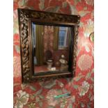 A WALL MIRROR WITH GILT GESSO FRAME