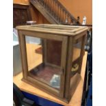 A WOOD AND GLASS DISPLAY CABINET WITH FRONT OPENING DOOR TOGETHER WITH KEY, FOUR VIEWING PANES,