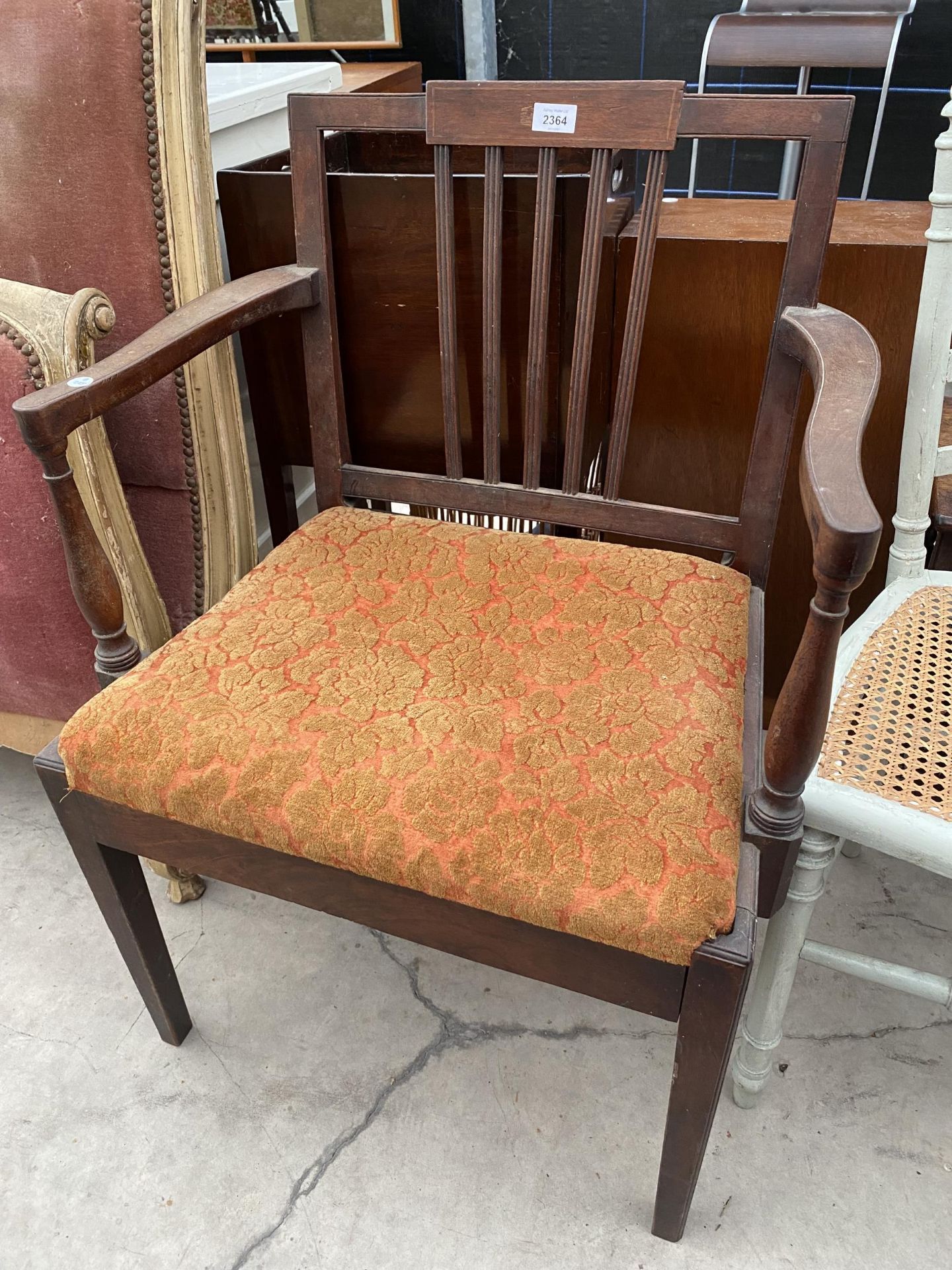 A GEORGIAN MAHOGANY ELBOW CHAIR