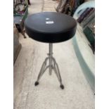 A HEIGHT ADJUSTABLE MUSIC STOOL