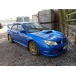 A 2007 SUBARU IMPREZA STI WRX TYPE UK IN WORLD RALLY BLUE WITH GOLD SPEEDLINE TURINI WHEELS. 2.5