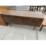 A RETRO CREAMY WALNUT AND CROSSBANDED BEAUTILITY SIDEBOARD, 63" WIDE