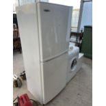 A WHITE HAIER UPRIGHT FRIDGE FREEZER