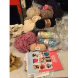 A SELECTION OF KNITTING AND CROCHETING YARN ACOMPANIED BY MAGAZINES AND CROCHETING PATTERNS