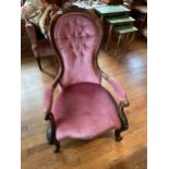 A MID VICTORIAN CARVED WALNUT EASY CHAIR WITH CABRIOLE LEGS, UPHOLSTERED IN PINK DRAYON