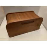 A ROLL TOP WOODEN STORAGE BOX