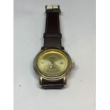 AN ASCOT CALENDAR WRIST WATCH WITH BROWN LEATHER STRAP SEEN WORKING BUT NO WARRANTY