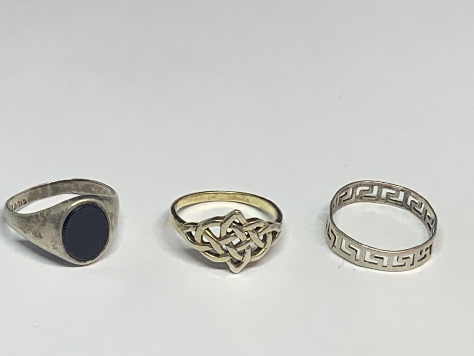 THREE SILVER RINGS TO INCLUDE TEO CELTIC DESIGNS