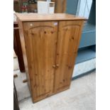 A MODERN PINE TWO DOOR WARDROBE, 32.5" WIDE