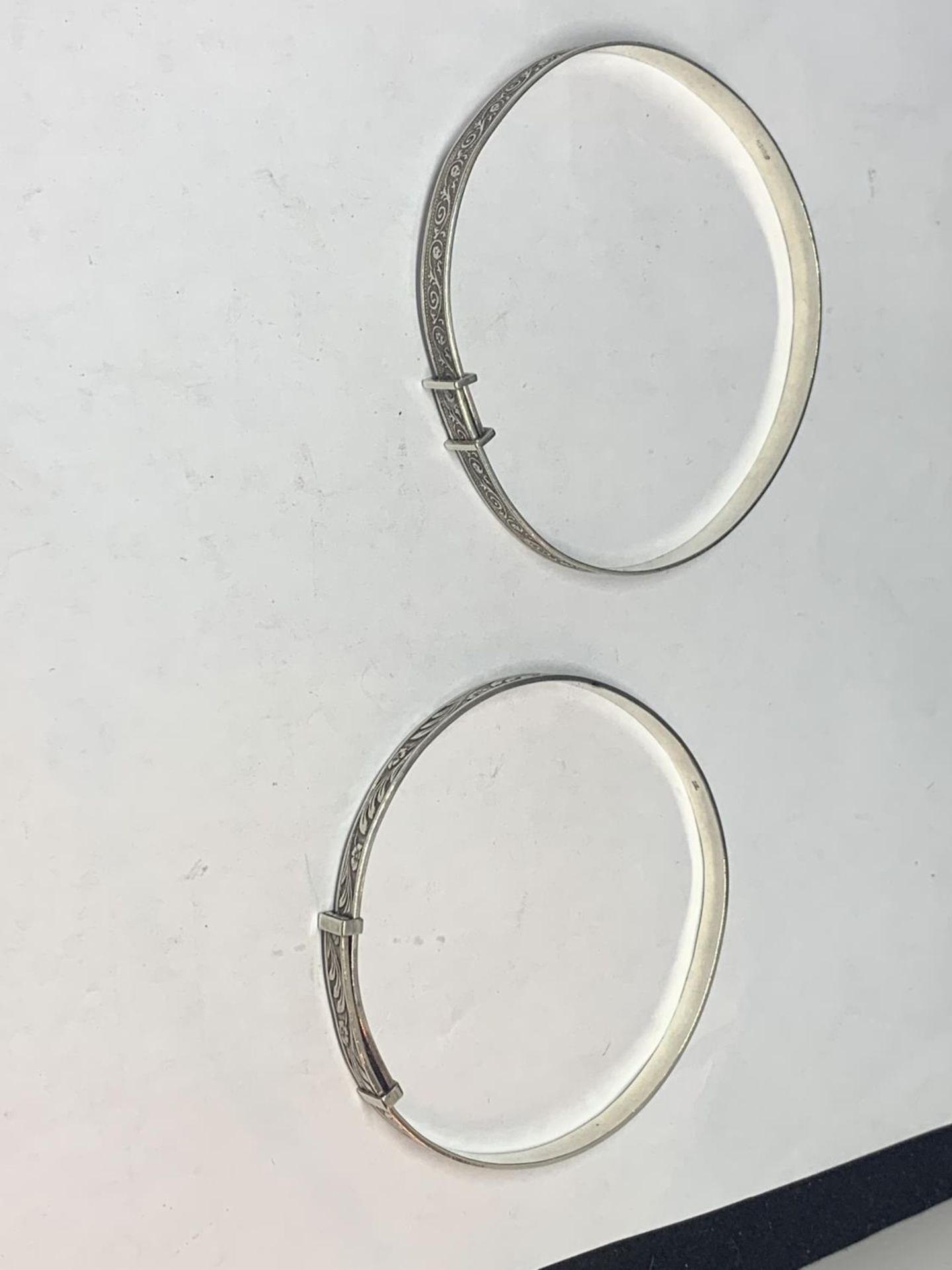 TWO SILVER CHRISTENING BANGLES