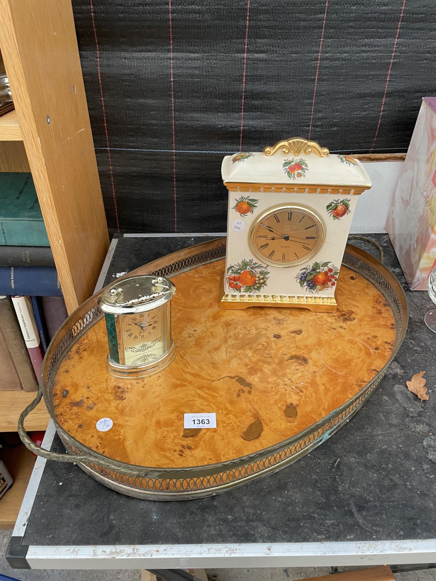 A LARGE BRASS SERVING TRAY AND TWO MANTLE CLOCKS