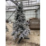 AN ARTIFICAL SNOW CHRISTMAS TREE ALL COMPLETE WITH STAND APPROXIMATELY 8FT TALL