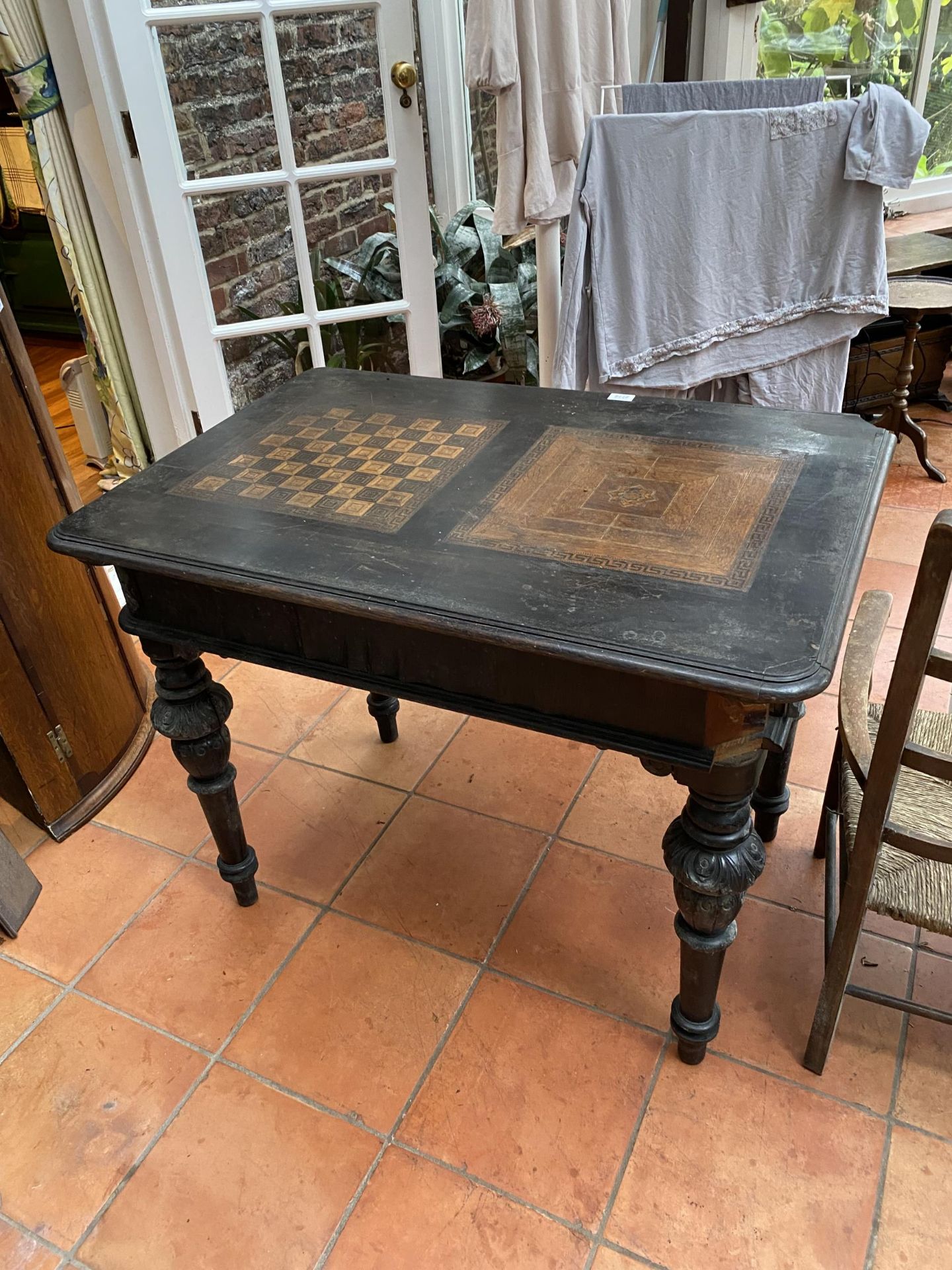 A VICTORIAN EBONISED GAMES TABLE WITH CHESS BOARD TOP AND TWO DRAWERS ON CARVED SUPPORTS 100CM X - Image 5 of 5