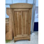 A CONTINENTAL STYLE PINE SINGLE DOOR WARDROBE