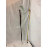 THREE WALKING STICKS/CANES TO INCLUDE AN USUAL TWISTED GLASS EXAMPLE