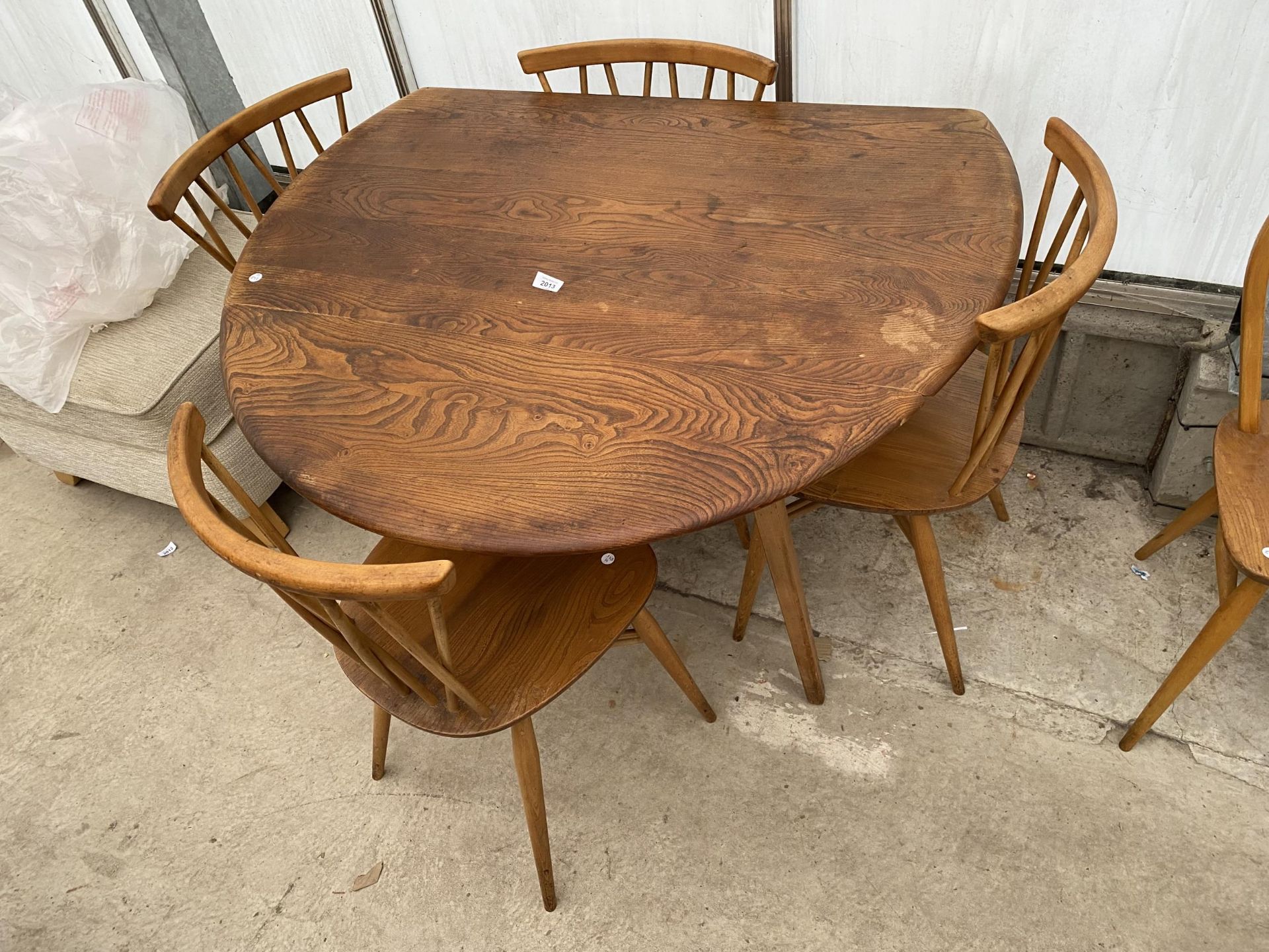A SET OF FOUR ERCOL DINING CHAIRS AND A DROP-LEAF DINING TABLE
