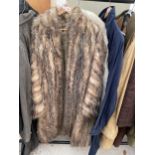 TWO LADIES LONG FUR COATS