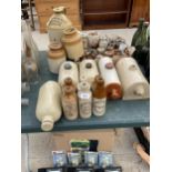 A LARGE QUANTITY OF VINTAGE STONEWARE ITEMS TO INCLUDE HOT WATER BOTTLES, BOTTLES AND A FLAGGON ETC