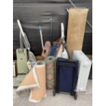 AN ASSORTMENT OF ITEMS TO INCLUDE VACUUMS, RUGS AND A HEATER ETC
