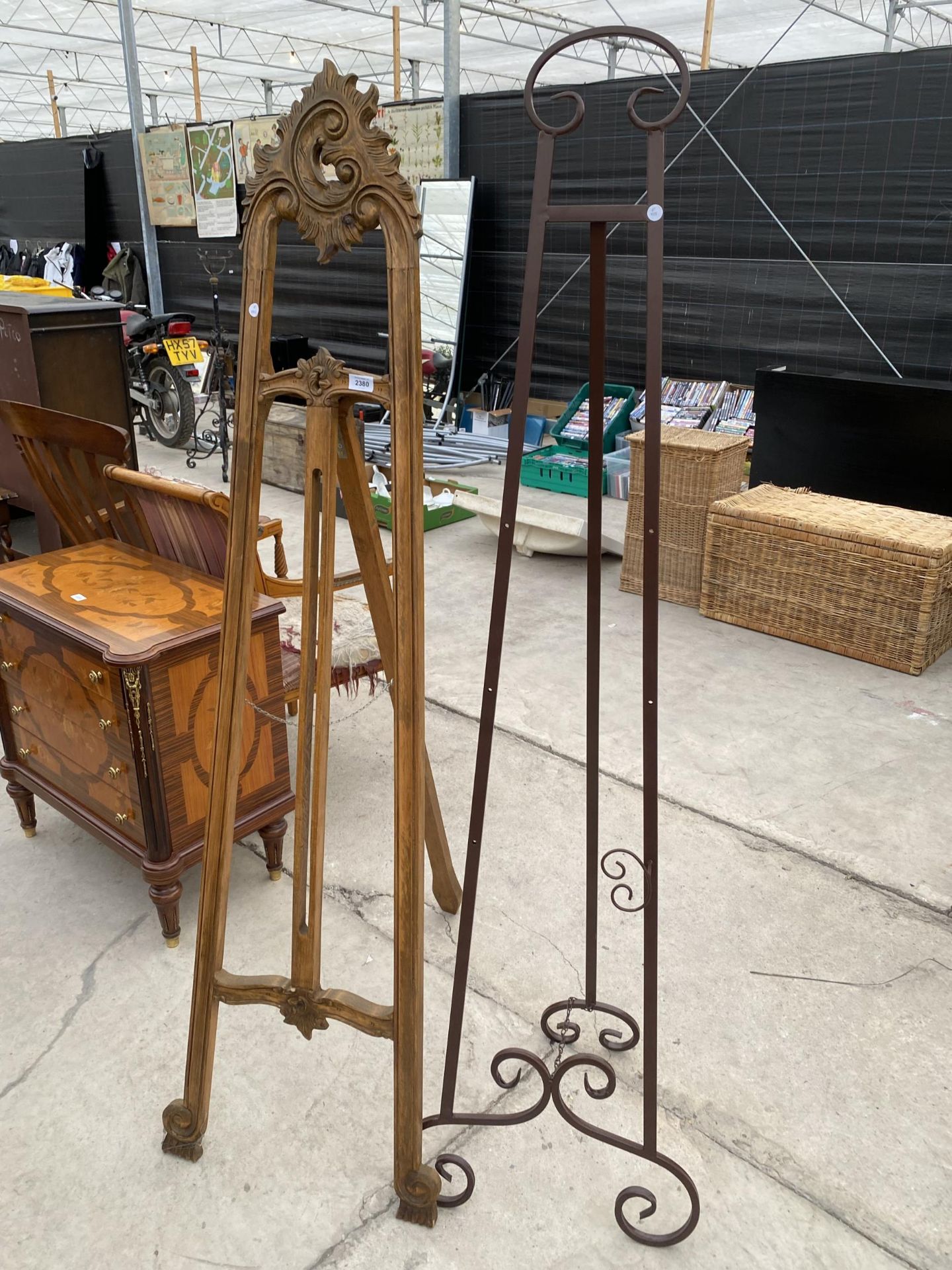 A CONTINENTAL STYLE EASEL AND METAL EASEL (SOME ADJUSTERS MISSING)