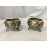TWO DECORATIVE THREE FOOTED MARKED SILVER BOWLS WITH CHURCH DESIGN GROSS WEIGHT 135 GRAMS