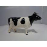 A BESWICK CLAYBURY LEEGWATER FRIESIAN COW FIGURE