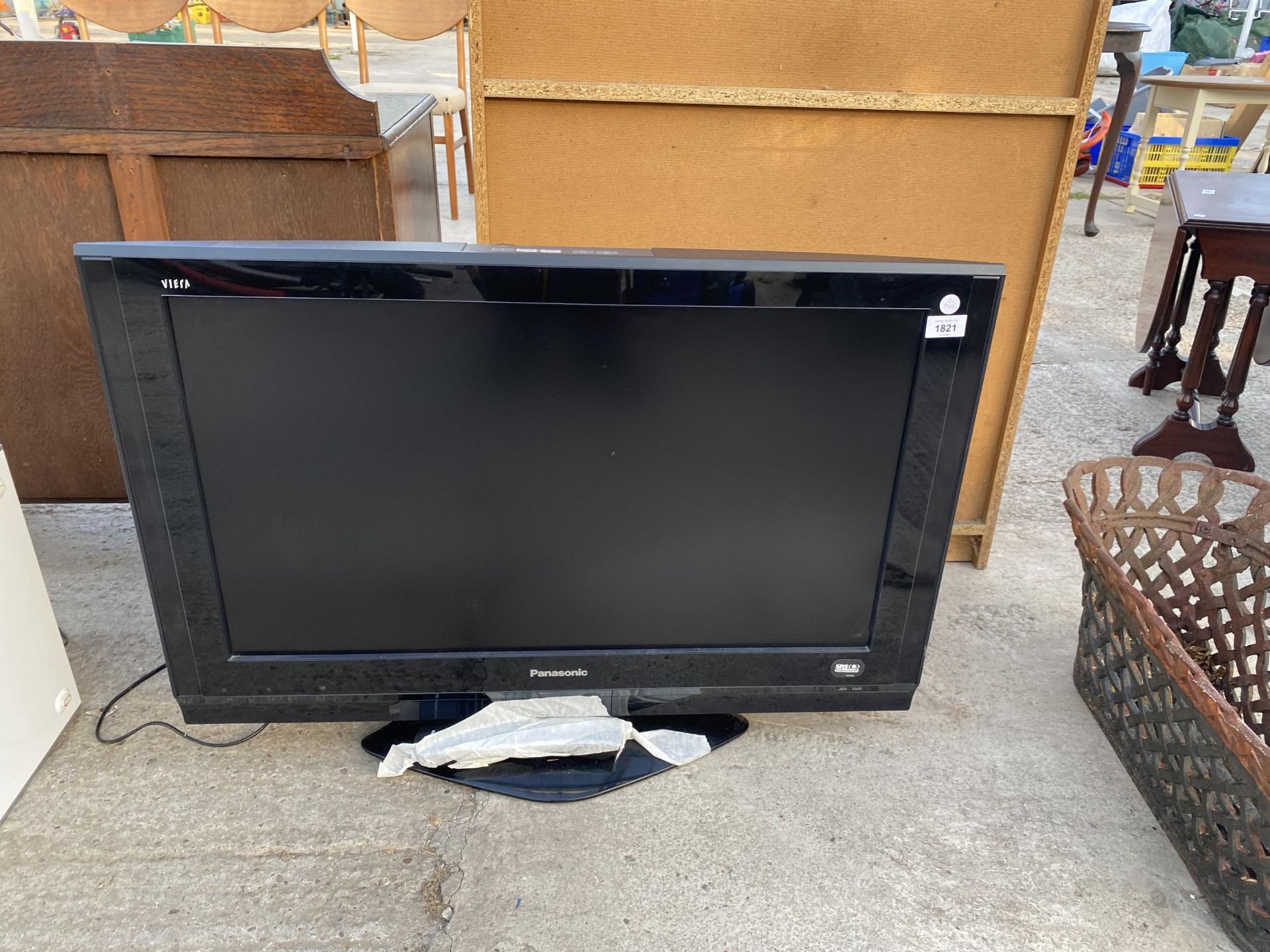 A 32" PANASONIC TELEVISION WITH REMOTE CONTROL