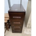 AN EARLY 20TH CENTURY NARROW OAK FOUR DRAWER OFFICE TYPE CHEST, 28 X 13"