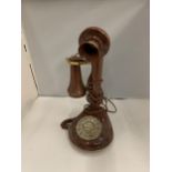 A REPRODUCTION CANDLESTICK TELEPHONE WITH PUSH BUTTON
