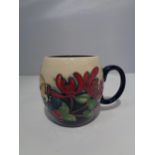 A MOORCROFT HONEYSUCKLE HAVEN MUG