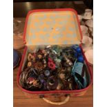 A SELECTION OF COSTUME JEWELLERY TO INCLUDE BEADS, NECKLACES AND BANGLES, ETC, IN A VANITY CASE